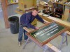 Putting the finishing touches on a Daggett Builders job site sign.